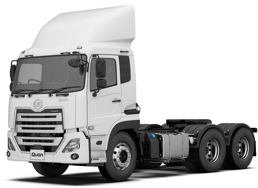 White semi-truck cab with three rear axles on a plain background.