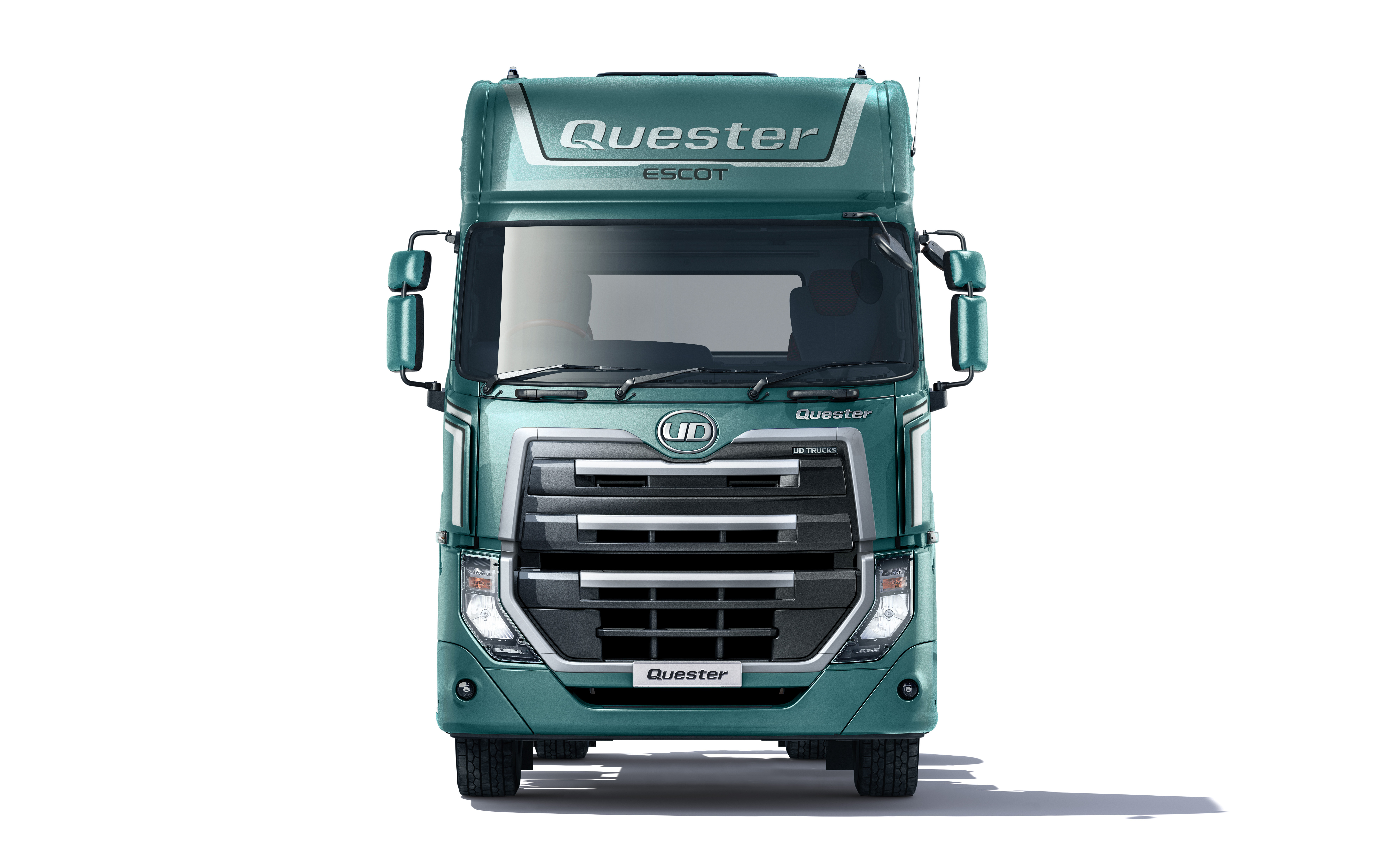 Green Questar truck photographed from the front on a white background.