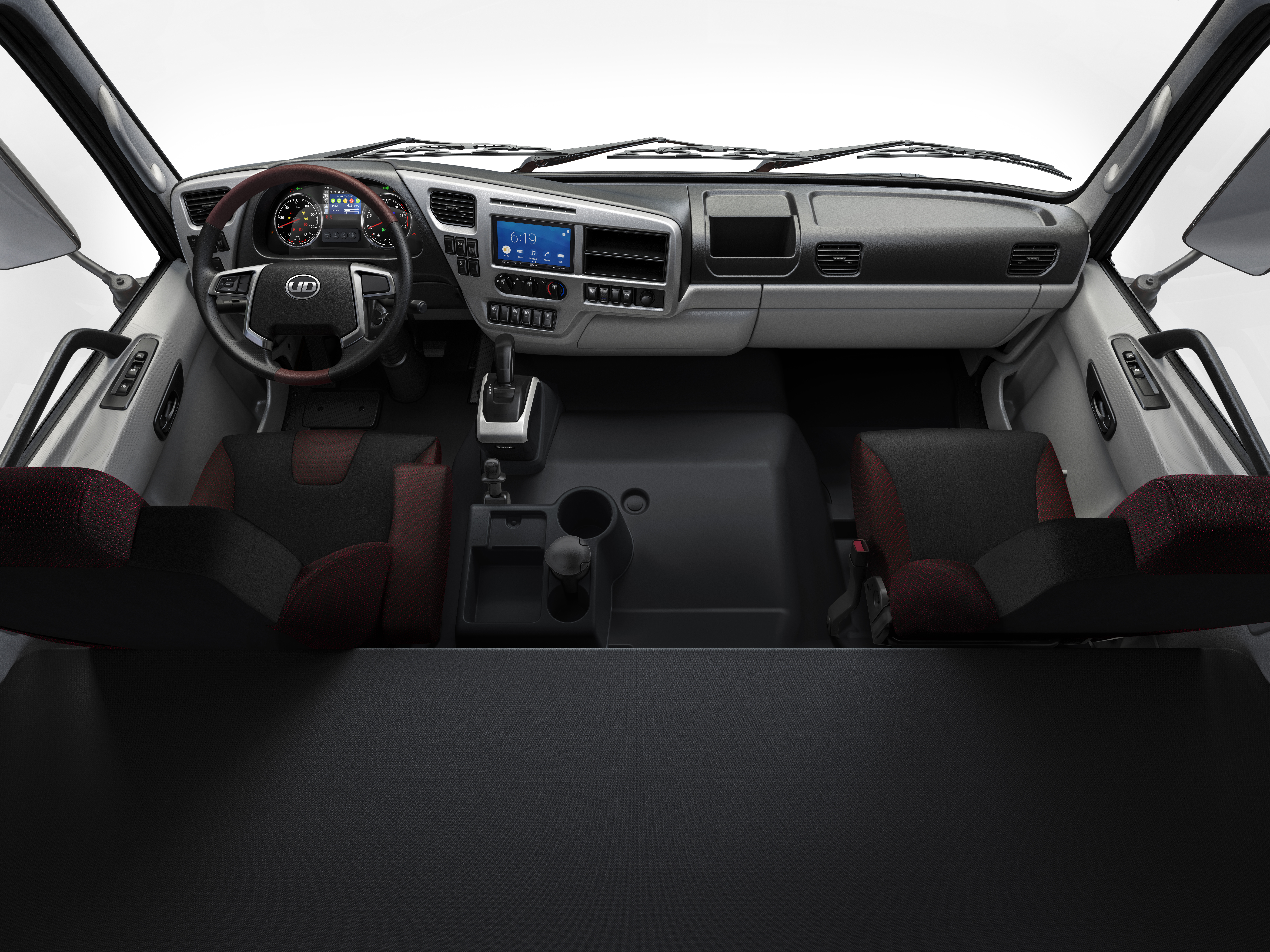 Quester Modern truck cab interior with two seats, steering wheel, and dashboard controls.