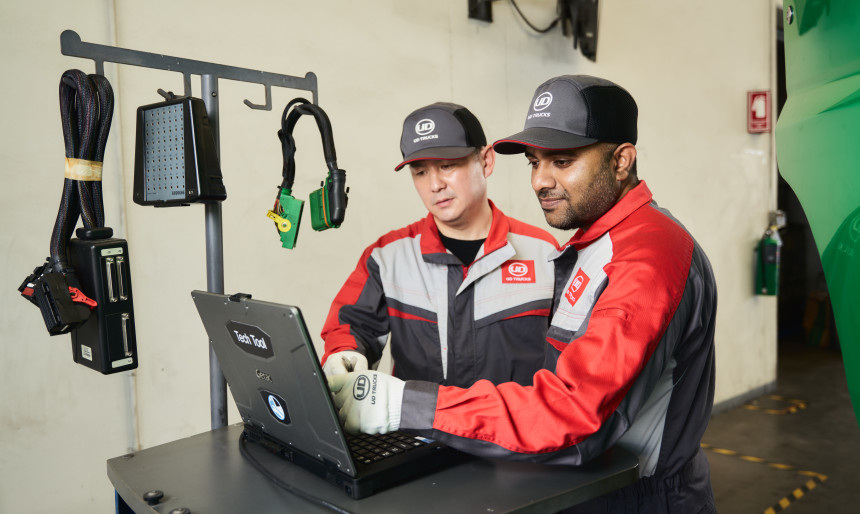 Two UD Trucks technician mechanics working 