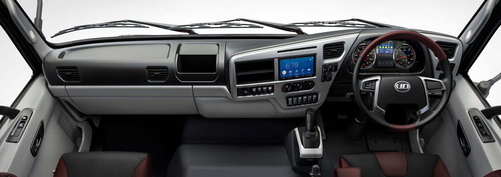 Quester Interior dashboard with steering wheel, controls, and digital display screens.