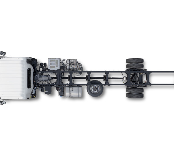 Truck chassis top view, showing cab, engine, and exposed frame.